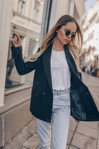 Stylish fashion girl posing in the street photo