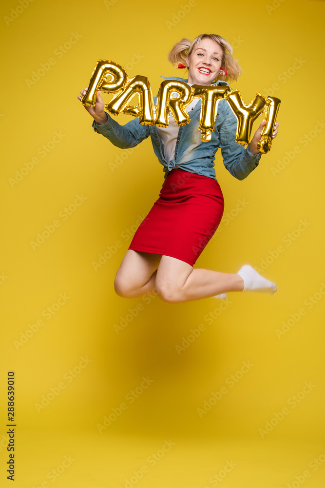 Fashionable womancelebrating a party event having fun and smiling with balloons Fashionable womancelebrating a party event having fun and smiling with balloons