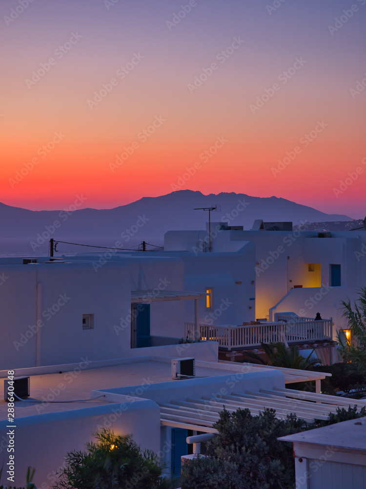 Breathtaking sunset at exotic city with white plain buildings Breathtaking sunset at exotic city with white plain buildings