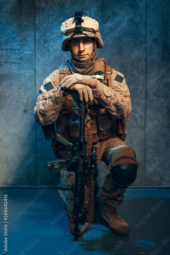 War, army, weapon concept. Private military contractor holding rifle War, army, weapon concept. Private military contractor holding rifle