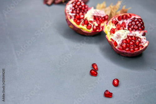 Sweet pomegranate over grey background