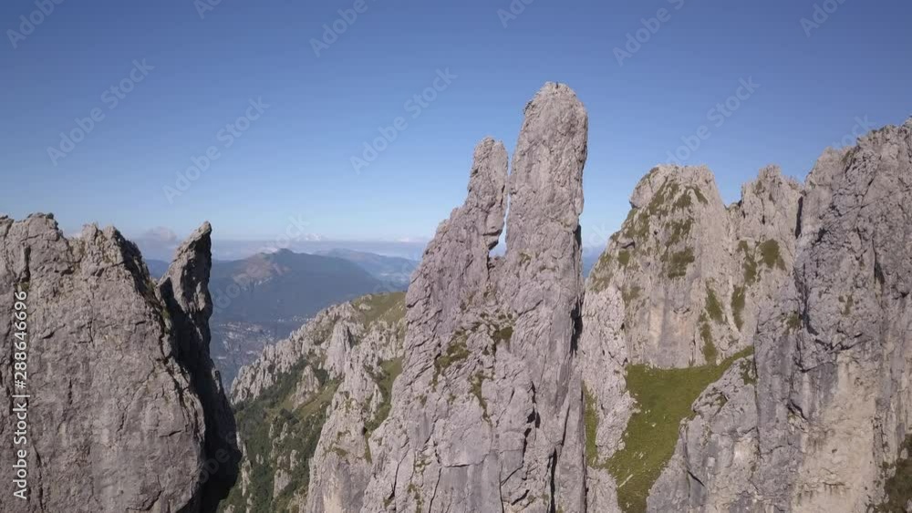 Drone aerial video of special rocks in Grigna mountain, in summer season, near Lecco, Lombardy, Italy. Famous, climbing area of Ragni di Lecco the association to which Walter Bonatti belonged. Drone aerial video of special rocks in Grigna mountain, in summer season, near Lecco, Lombardy, Italy. Famous, climbing area of Ragni di Lecco the association to which Walter Bonatti belonged.