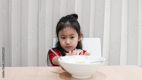 Portrait of Asian child girl Refuse to eat food or food bored, Child Anorexia