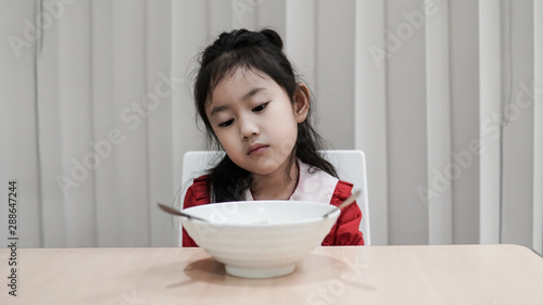 Portrait of Asian child girl Refuse to eat food or food bored, Child Anorexia