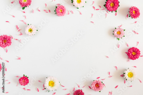Frame made of pink and white flowers on white background. Valentines Day, Easter, Birthday, Mother's day. Flat lay, top view, copy space