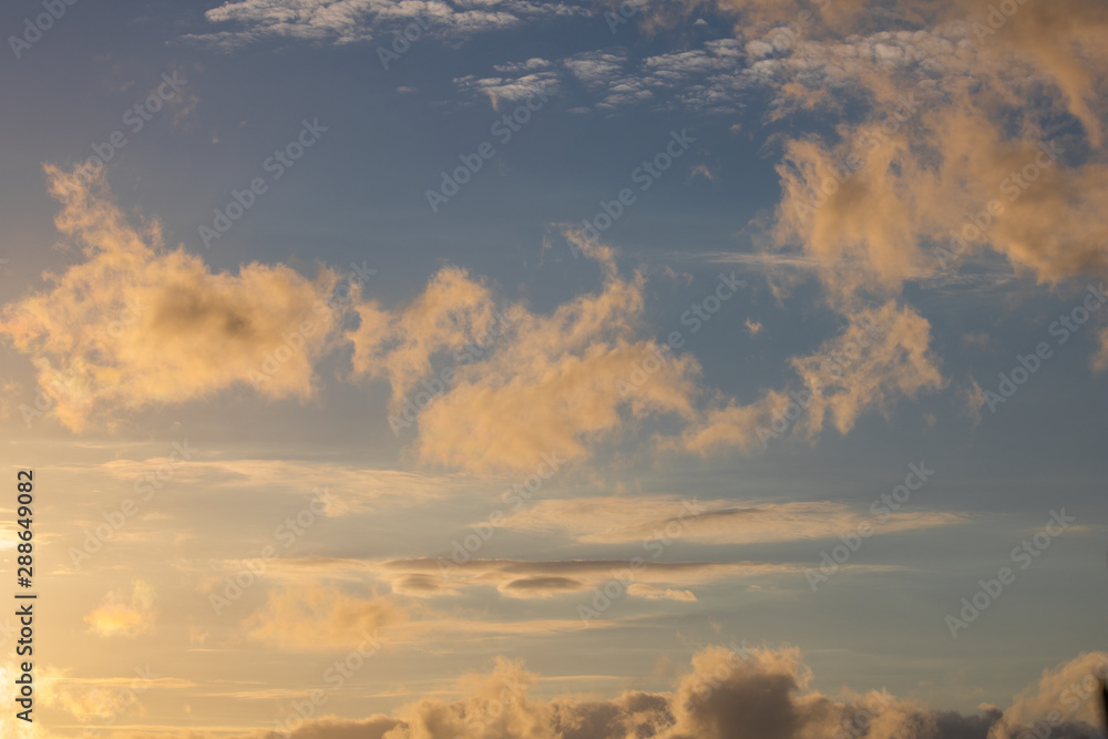 Obraz premium Dramatic golden blue sunset or sunrise with clouds.