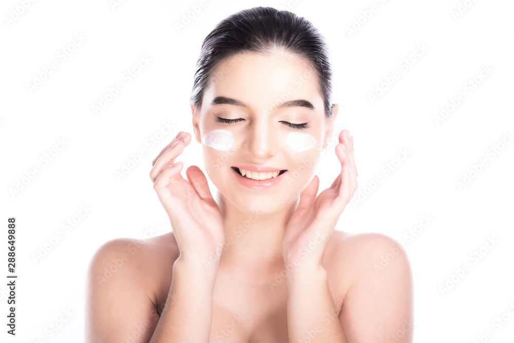 Beauty woman face isolate in white background. Young caucasian girl, perfect skin, cosmetic, spa, beauty treatment concept. Cream on face, eye close big smile. Beauty woman face isolate in white background. Young caucasian girl, perfect skin, cosmetic, spa, beauty treatment concept. Cream on face, eye close big smile.