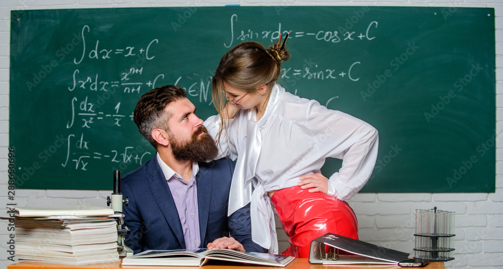 Distracting him from work. Private lesson. Check knowledge. Teacher and  student in classroom chalkboard background. Sexy seduction. Desire for  knowledge. Sex knowledge. Need for real experience foto de Stock | Adobe  Stock