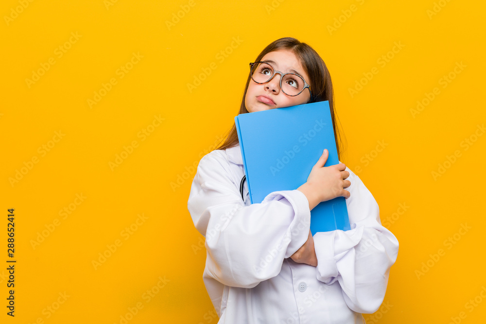 Little caucasian girl wearing a doctor costume Little caucasian girl wearing a doctor costume