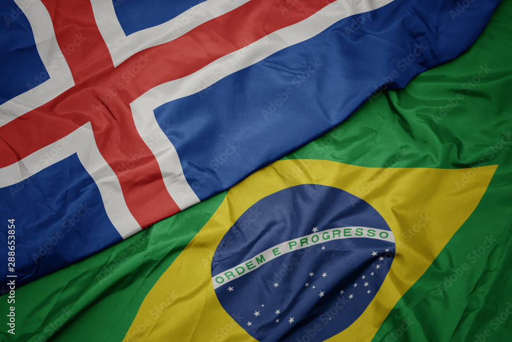 waving colorful flag of brazil and national flag of iceland.