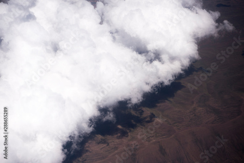 Low puffy clouds while flying into La Paz, Bolivia, South America