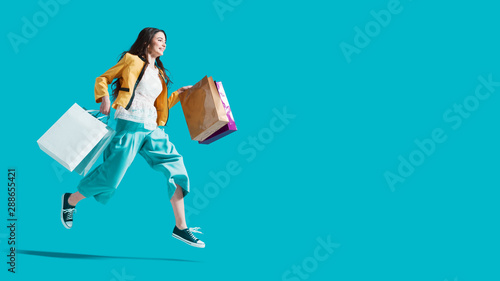 Cheerful happy woman enjoying shopping photo