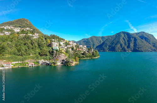 Panorama aerial view of the lake Lugano, mountains and city Lugano, Ticino canton, Switzerland. Scenic beautiful Swiss town with luxury villas. Famous tourist destination in South Europe © oleg_p_100