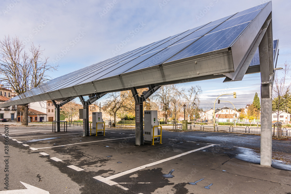 SAN ILDEFONSO, SEGOVIA, SPAIN - SEPTEMBER 24, 2017: Car charging station for self-sufficient and first photovoltaic panels in Europe. it is also free. SAN ILDEFONSO, SEGOVIA, SPAIN - SEPTEMBER 24, 2017: Car charging station for self-sufficient and first photovoltaic panels in Europe. it is also free.