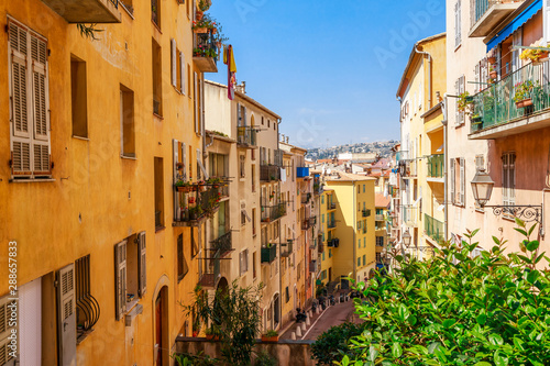 Street view of Nice, Cote d'Azur, France, South Europe. Beautiful city and luxury resort of French riviera. Famous tourist destination with nice beach on Mediterranean sea
