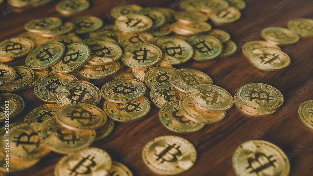 bitcoins on wooden desk