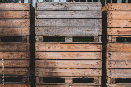Wooden storage crates on rows. Old storage wooden bins