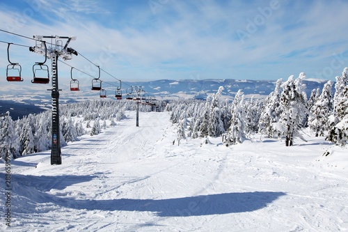 chair lift on mountain for downhill skiers © Daniel Prudek