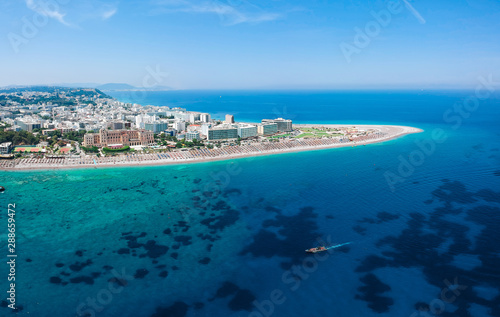 Fototapeta Naklejka Na Ścianę i Meble -  Aerial birds eye view drone photo of Elli beach on Rhodes city island, Dodecanese, Greece. Panorama with nice sand, lagoon and clear blue water. Famous tourist destination in South Europe