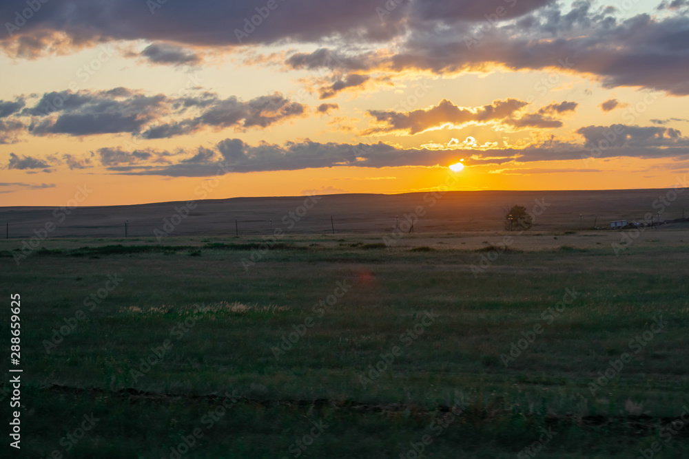 Sunny sunset in the steppes of Kazakhstan.