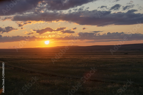 Sunny sunset in the steppes of Kazakhstan.