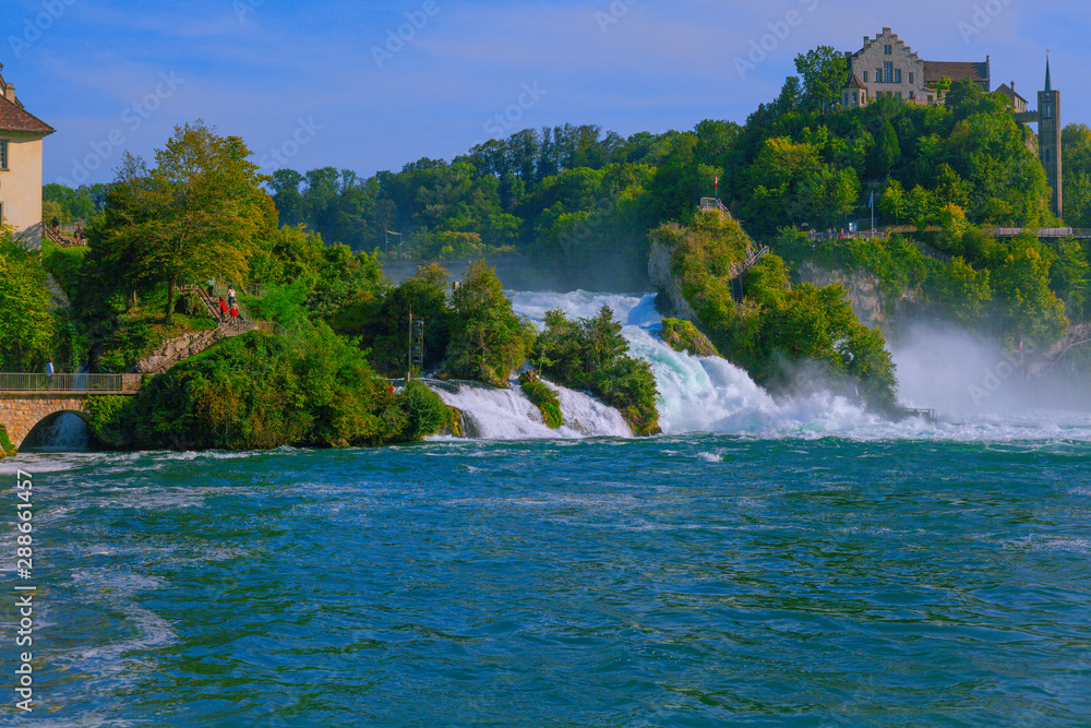 The Rhine Falls near the city Schaffhausen in Switzerland. Globally considered a rather small waterfall, but still attraction for tourists from all over the world.