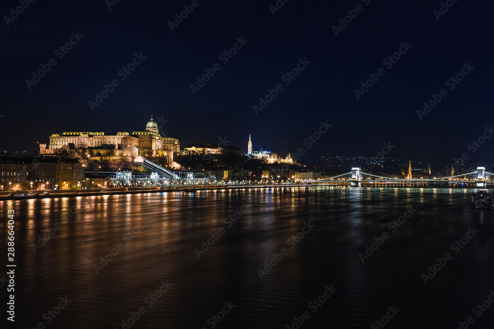 Night view of Budapest. Cityscape of famous tourist destination with Danube and bridges. Travel illuminated landscape in Hungary, Europe.