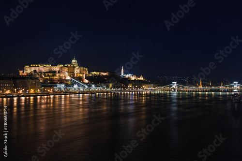 Night view of Budapest. Cityscape of famous tourist destination with Danube and bridges. Travel illuminated landscape in Hungary, Europe.