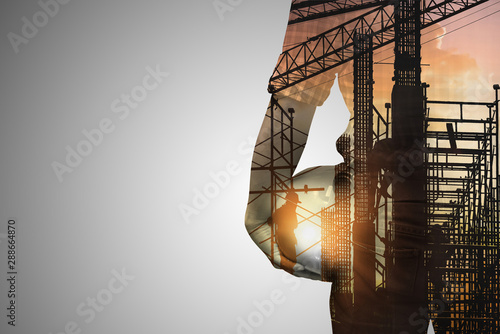 Fototapeta Double exposure concept with engineer  or foreman on construction site of background,copy space for text