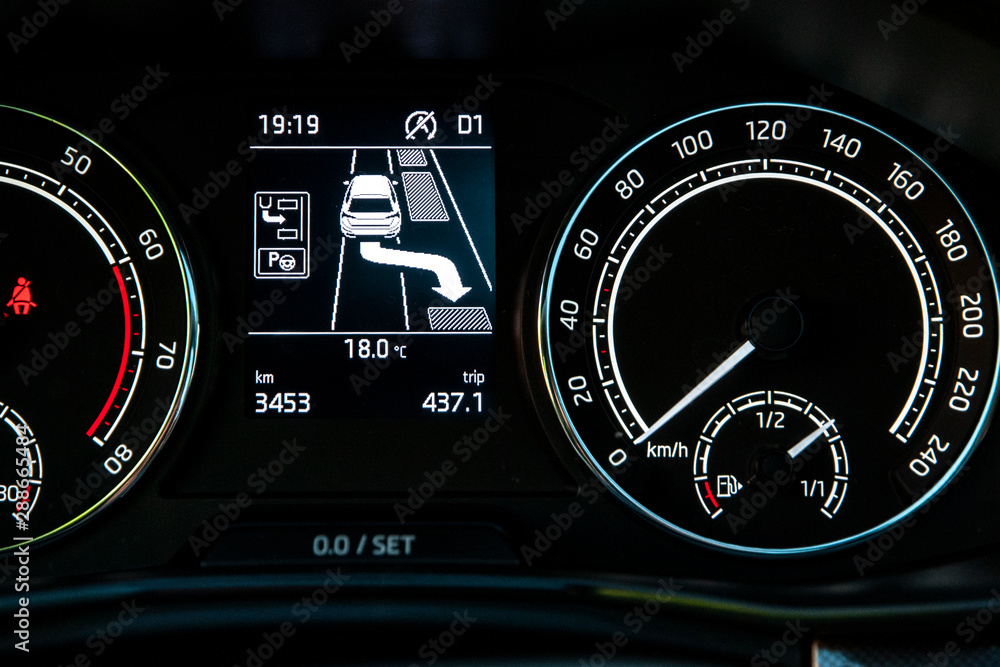 Fototapeta premium Car's dashboard shows automated parking instructions