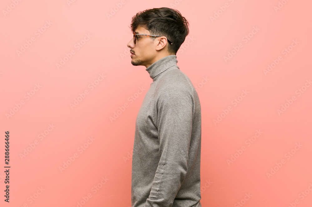 Young smart student man gazing left, sideways pose. Young smart student man gazing left, sideways pose.