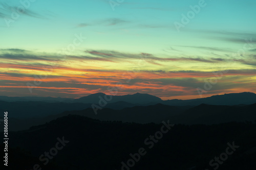 Panoramic mountain and dramatic sky sundown background © Freepik