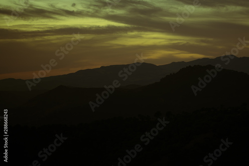 Wallpaper Mural Green and yellow shades of clouded sky Torontodigital.ca