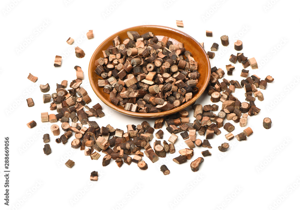 Cinnamon twig chinese herbal medicine on a white background pestle over white background. Gui zhi. Cinnamon twig chinese herbal medicine on a white background pestle over white background. Gui zhi.