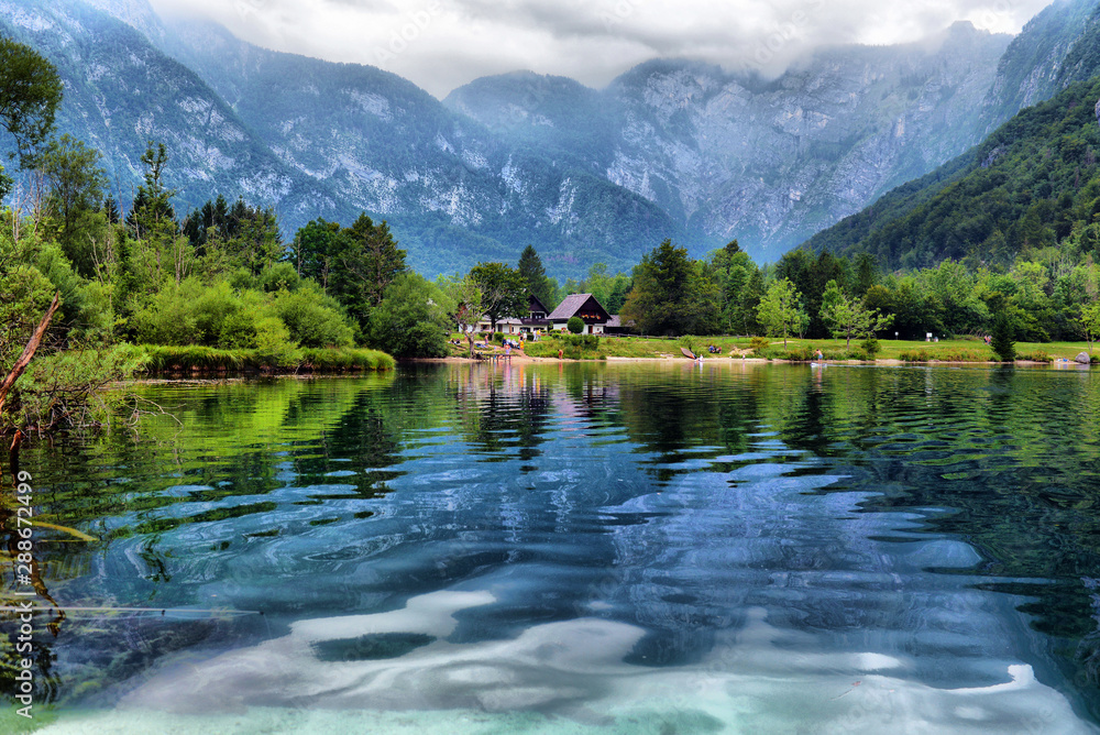 Panoramic view of Lake Bohinj, the largest permanent lake in Slovenia. It is located within the Bohinj Valley of the Julian Alps