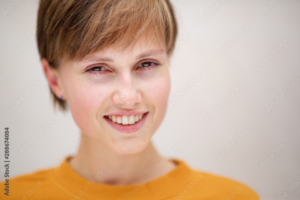 Close up beautiful young woman against white background Close up beautiful young woman against white background