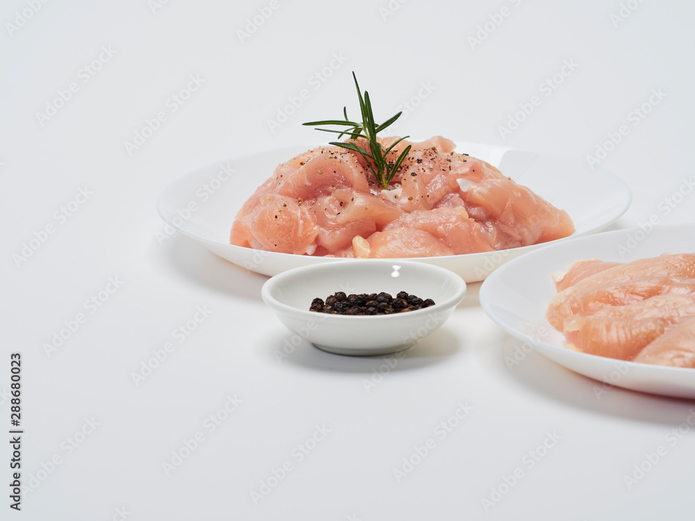 Fresh chicken tenderloin in white plate Fresh chicken tenderloin in white plate