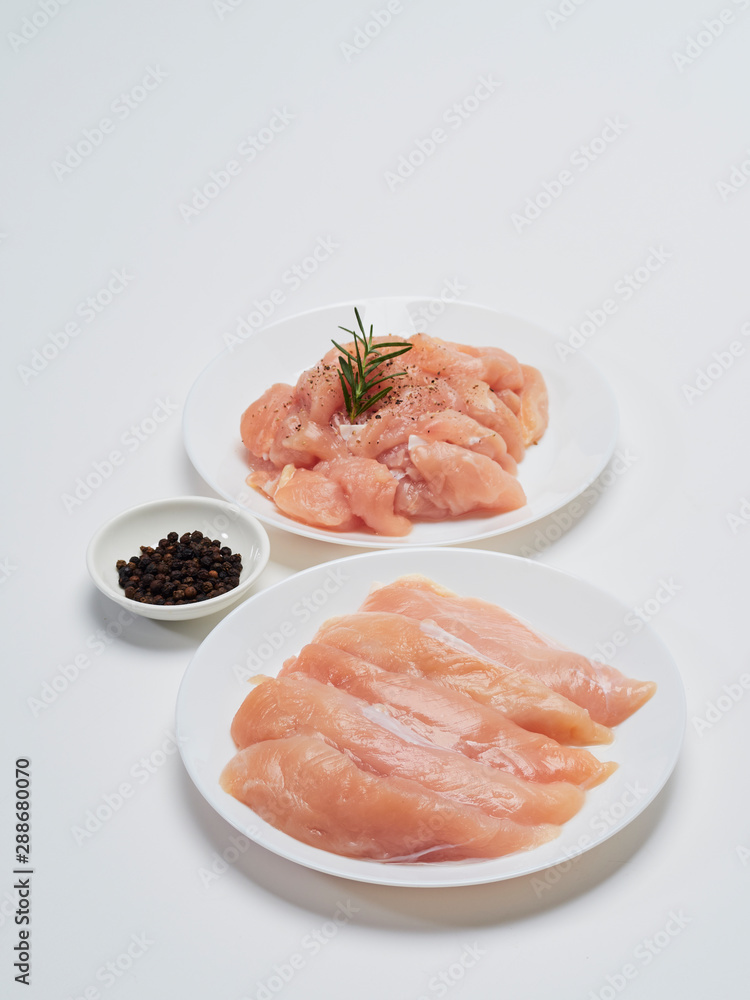 Fresh chicken tenderloin with wooden board, knife. Fresh chicken tenderloin with wooden board, knife.