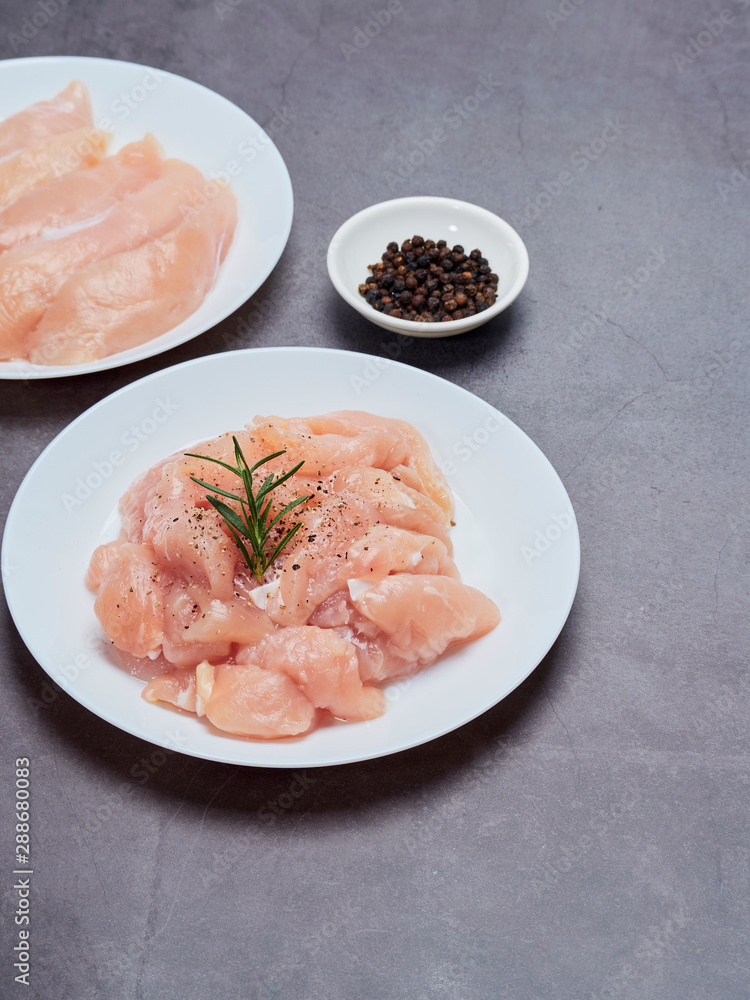 Fresh chicken tenderloin on stone table top Fresh chicken tenderloin on stone table top
