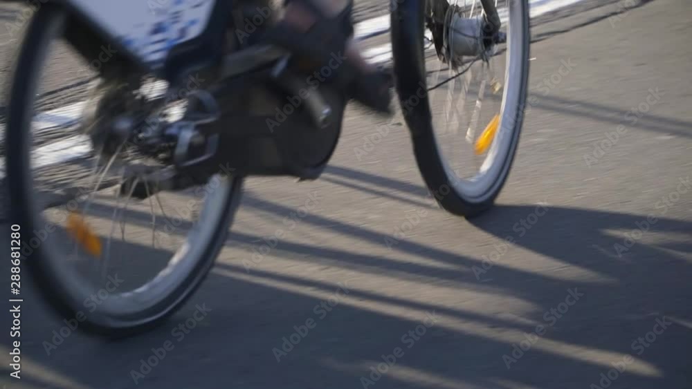 Two cyclists riding on the track, Two cyclists riding on the track,
