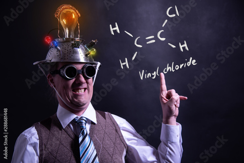 Nerd presenting handdrawn chemical formula of vinyl chloride photo