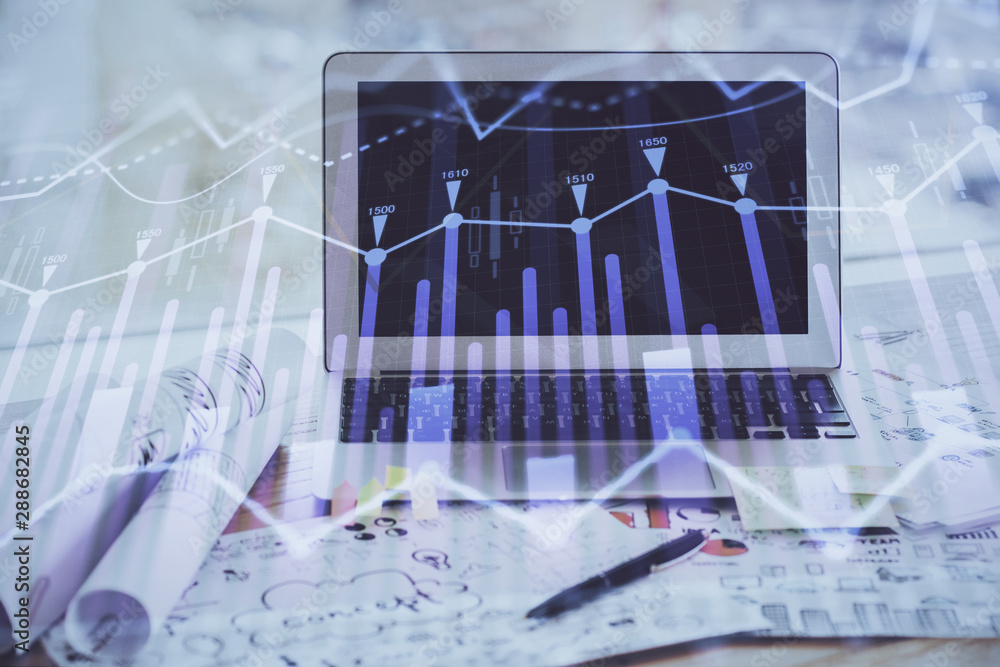 Stock market graph on background with desk and personal computer. Multi exposure. Concept of financial analysis. Stock market graph on background with desk and personal computer. Multi exposure. Concept of financial analysis.