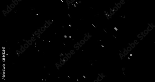 Flying dust particles on a black background
