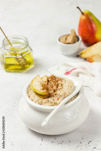 Honey pear cinnamon oats. Selective focus, space for text.