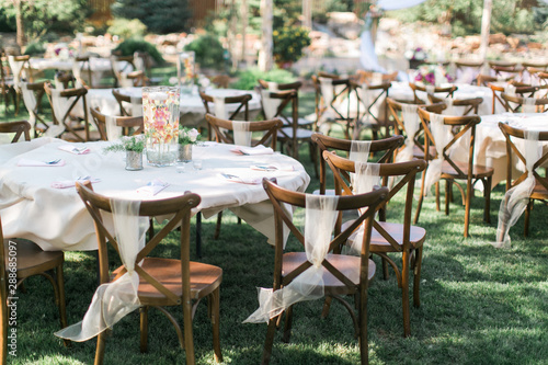 Принти на полотні Chairs and table at outdoor summer wedding, wedding reception decor, ceremony