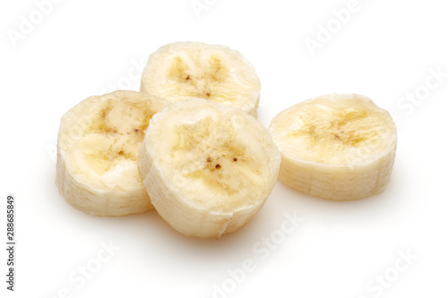 Peeled banana slices isolated on white background