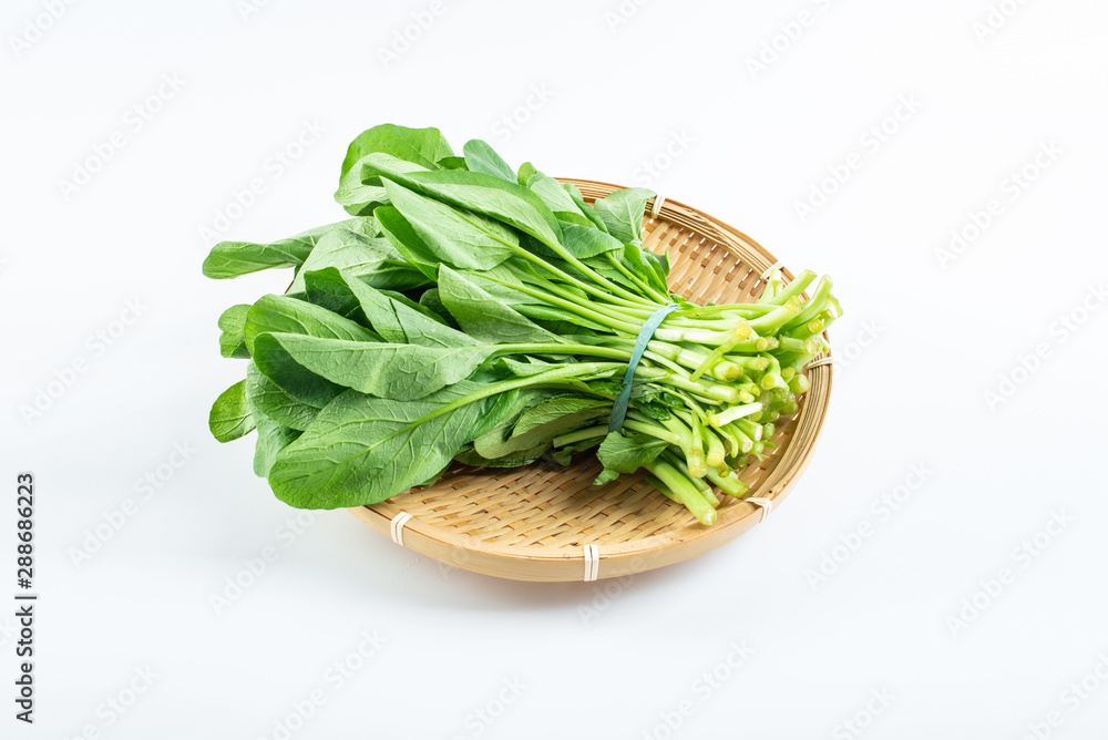 a handful of fresh green cabbage on a white background a handful of fresh green cabbage on a white background