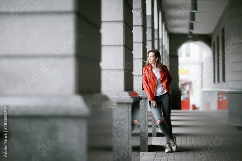 walk girls in Moscow / lonely girl in autumn walks in a jacket around the city