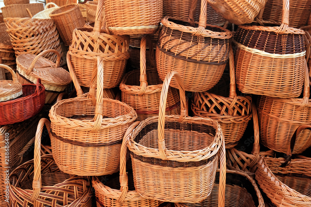 stack of traditional eco wicker baskets background