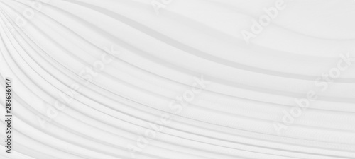 Soft smooth white silk fabric background. Fabric texture, soft waves